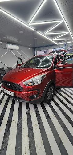 Detailing bay with red car
